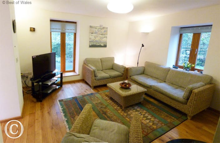 Lounge with stove at this cosy self catering, Brecon Beacon